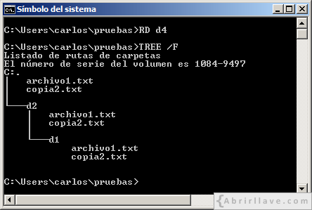 Ventana del Símbolo del sistema en Windows donde se muestra cómo se puede eliminar un directorio vacío usando el comando RD - Ejemplo del tutorial de CMD de {Abrirllave.com